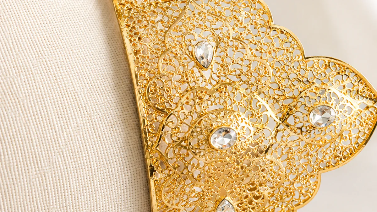 A worked gold heritage piece on ivory silk